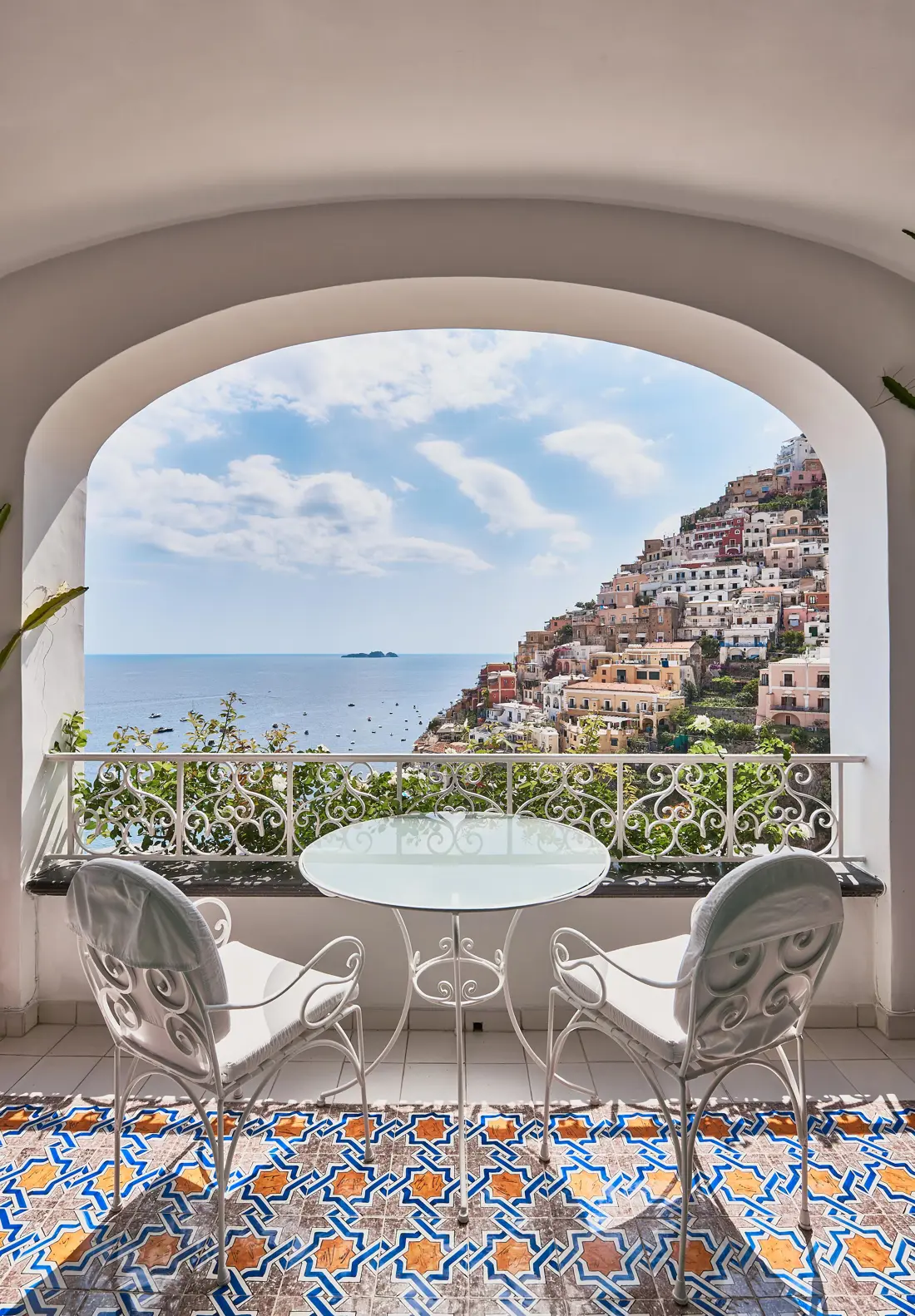 A tiled balcony framing the view of Positano