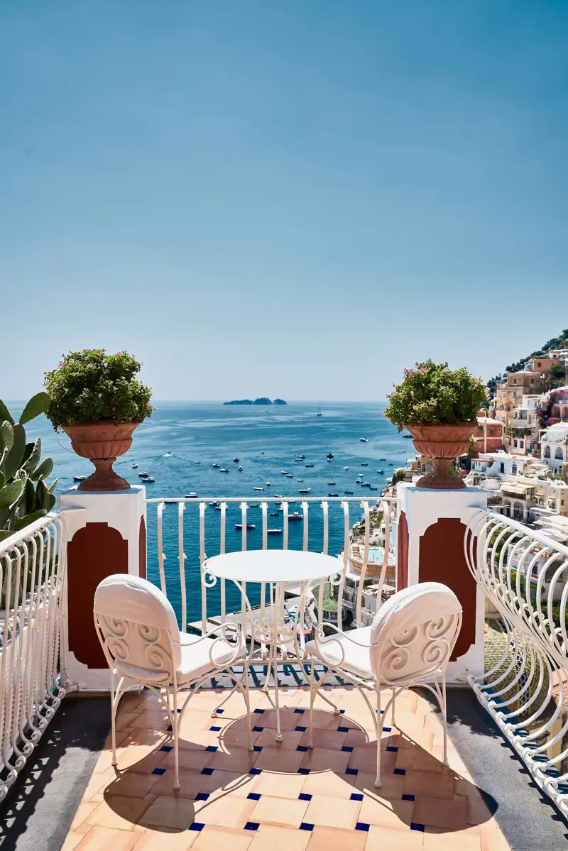 A balcony table for two above the sea