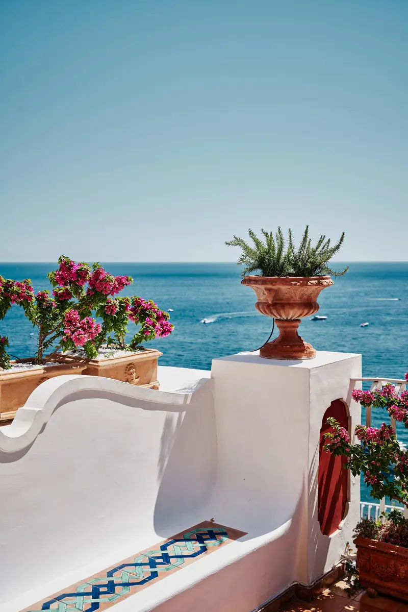 Bougainvillea on a white terrace above the sea